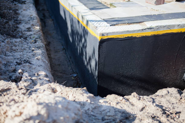 Professional Waterproofing technician working in Bailey, MI
